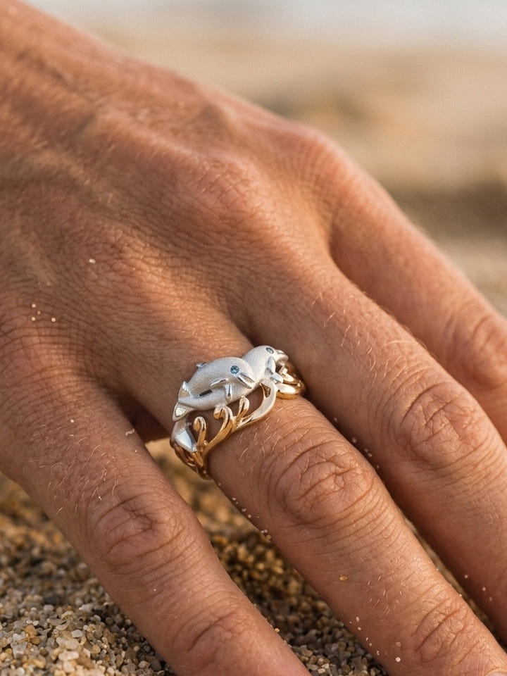 14k 20mm "Flipping Couple" Dolphin Ring with 2 blue diamonds — close-up on model