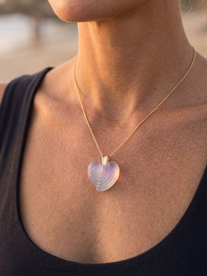 14K Yellow Gold Large Wing Heart Pendant — close-up on model