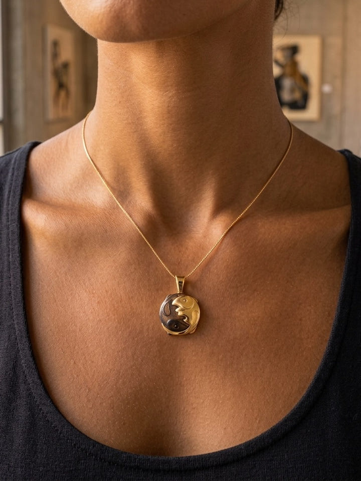 14K Yellow Gold Two Fish Pendant — close-up on model