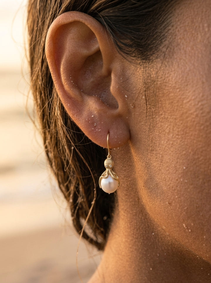 Gold Octopus Earrings With White Fresh Water Pearls & Diamonds — close-up on model