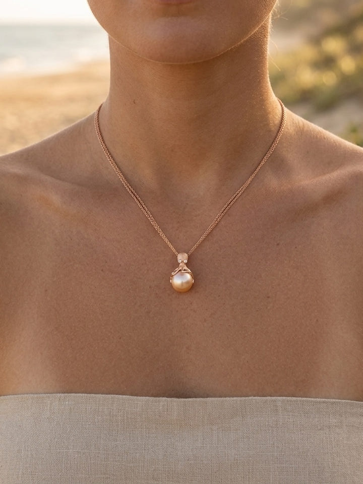 Rose Gold Octopus Pendant With 12mm Peach Fresh Water Pearl & Diamonds — close-up on model