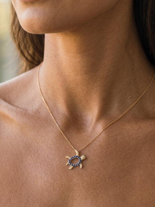 14k 2/tone 12mm "Hawaiian Petroglyph" Honu Pendant with 2 Diamonds and 15 Blue Sapphires