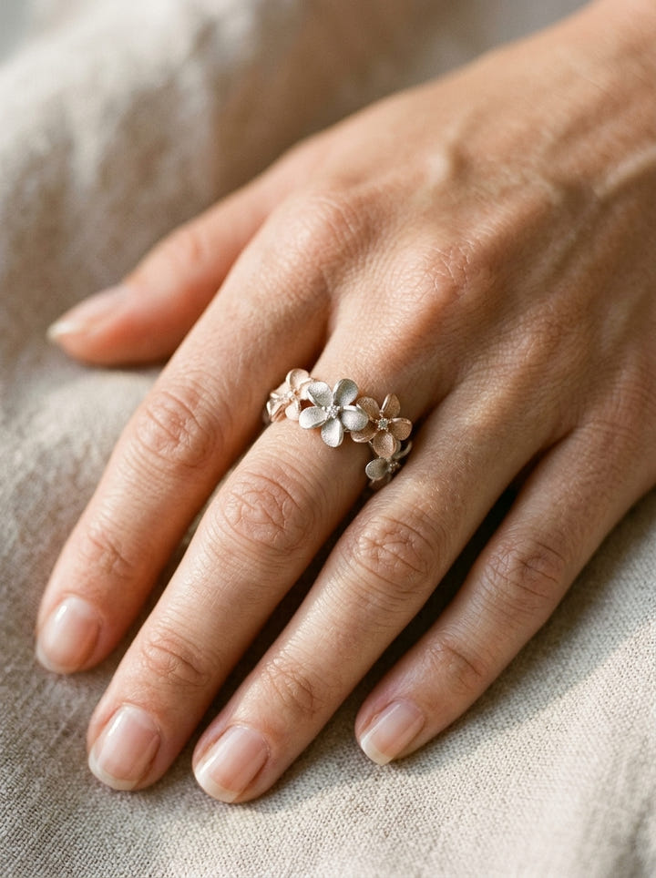 14k 2/tone 8mm Plumeria Ring with 4 Diamonds — close-up on model