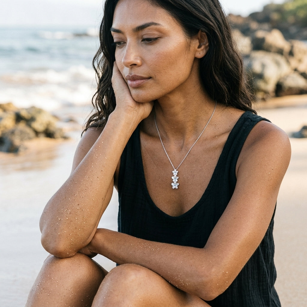 14k Plumeria Lei Slide Pendant with blue diamonds — worn on model (brunette, view 2)