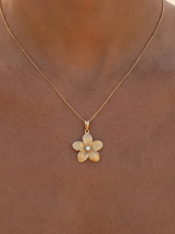 18mm 14k Plumeria Pendant with Diamond — close-up on model