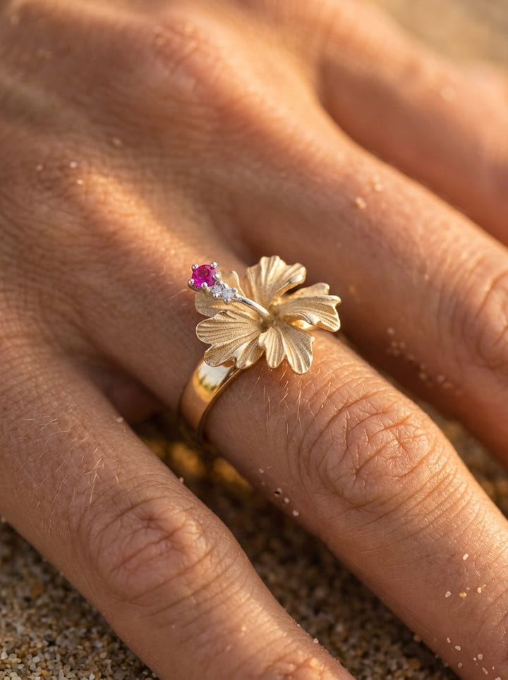 13mm 14K Hibiscus Ring with 2 diamonds and ruby — close-up on model