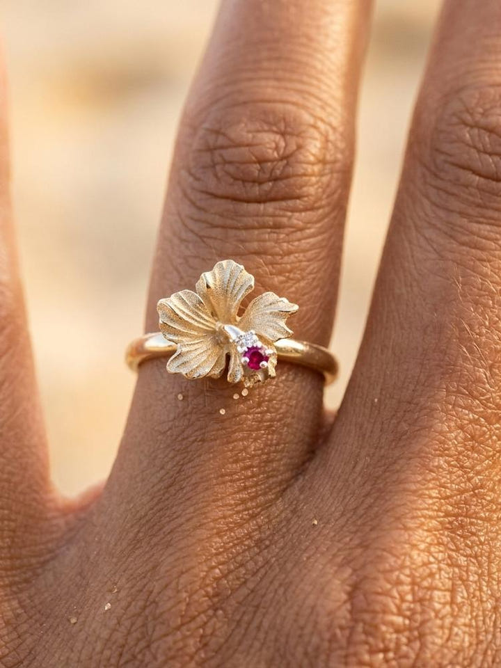 14K Hibiscus Ring with 0.015ct ruby and 0.02ct diamond — close-up on model