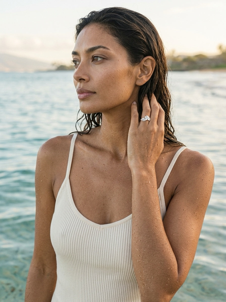 11mm Precious Silver Plumeria Ring with 3 White Sapphire — worn on model (brunette, view 1)