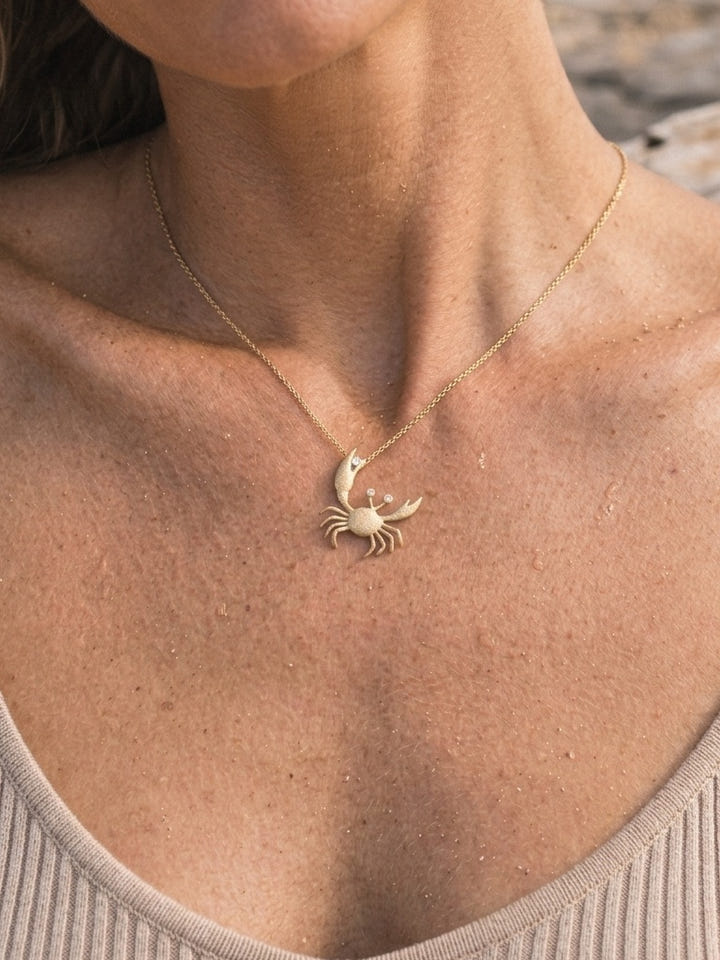 14k 22mm Crab Pendant with 2 Diamonds — close-up on model