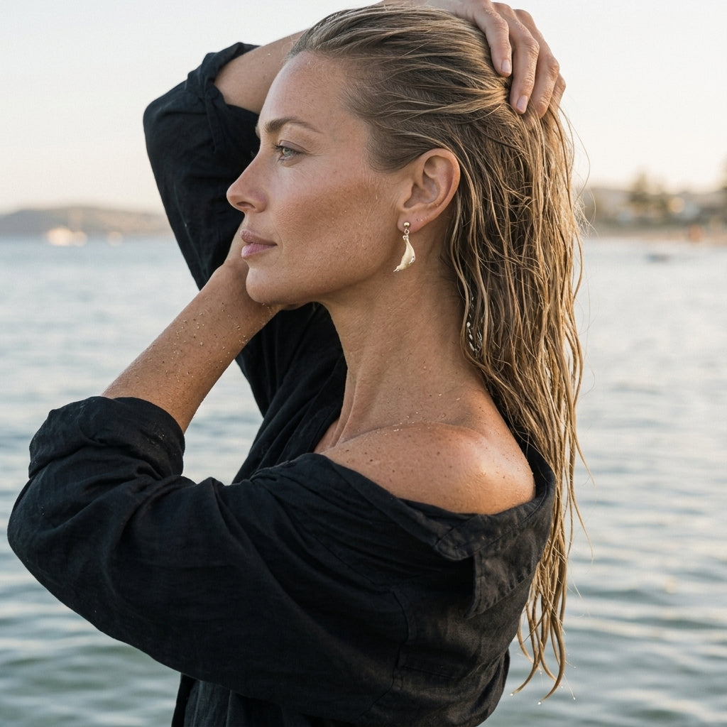 14k 20mm "Diving" Seal Ball Post Earrings with 4 Diamonds — worn on model (blonde, view 1)