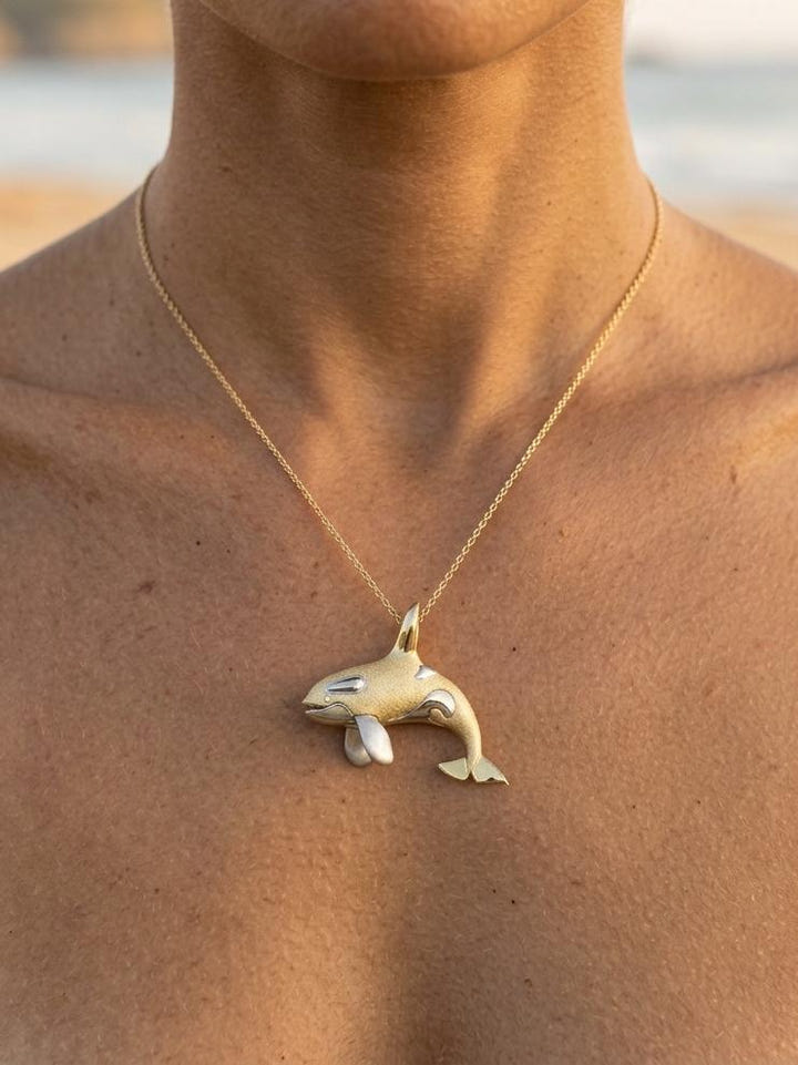14k 40mm 2/tone (White and Yellow) Killer Whale Pendant with 2 Diamonds — close-up on model