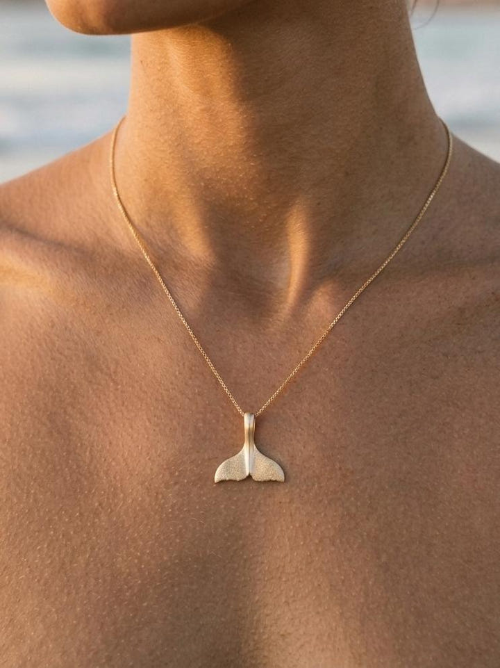 14k 16mm Whale Saw Tail Pendant — close-up on model