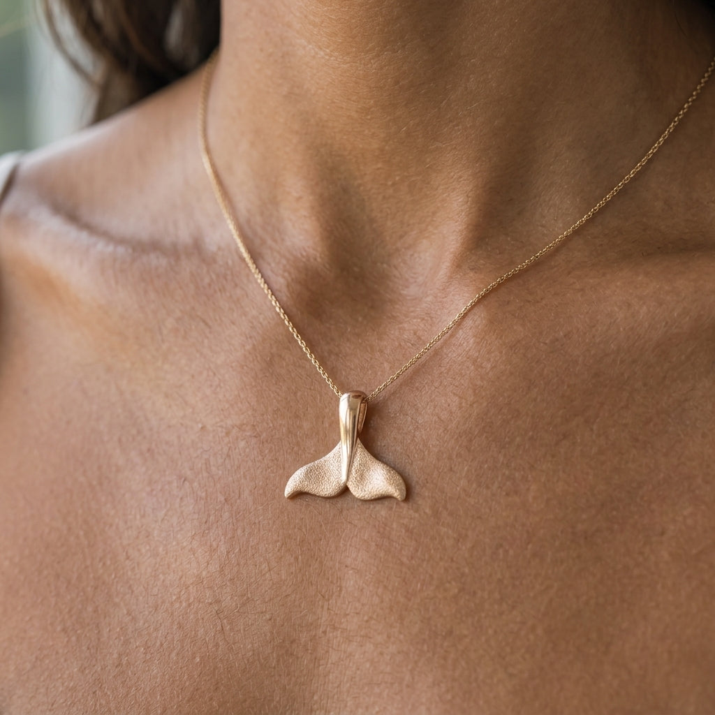 14K 15mm Whale Tail Pendant — worn on model (brunette, view 2)