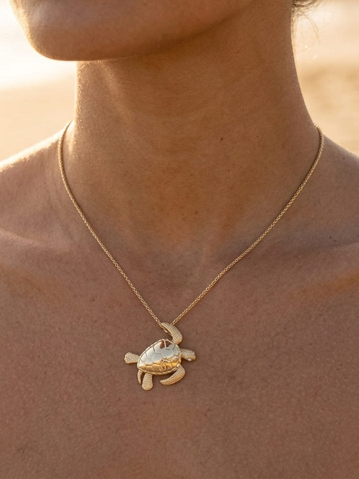 14k 30mm Sea Turtle Pendant with 2 Diamonds — close-up on model