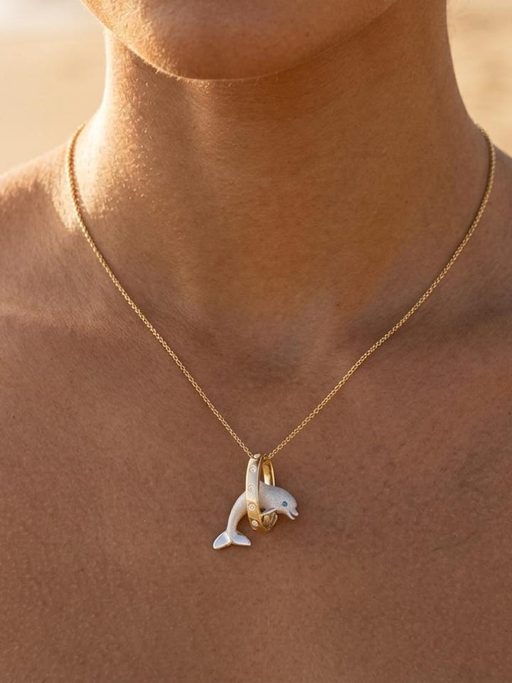 14k 2/tone 20mm "Jumping Loop" Dolphin Pendant with 5 diamonds — close-up on model