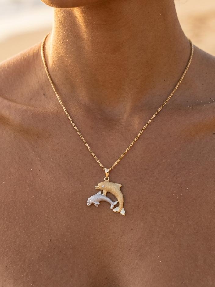 14k 2/tone 22mm "Mother & Calf" Dolphin Pendant with 2 diamonds — close-up on model