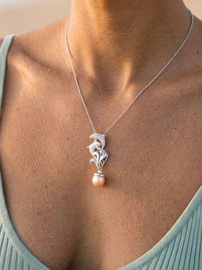 Precious Silver 20mm "Sliding Couple" Dolphin Pendant — close-up on model