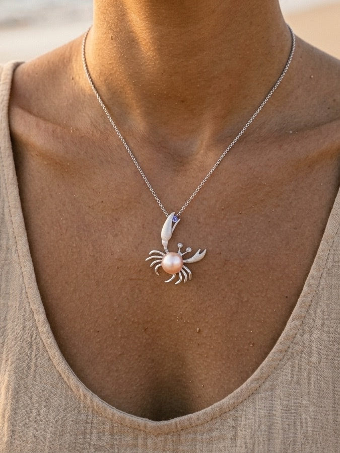 Precious Silver 22mm Crab Pendant with 2 Diamonds, Water Pearl and Tanzanite — close-up on model