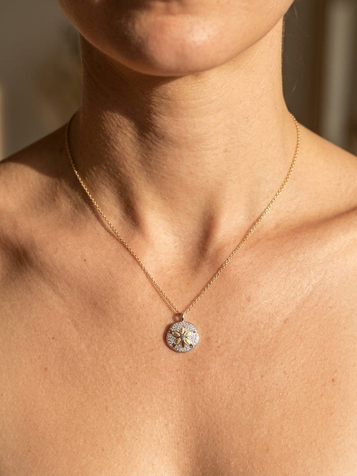 14k 2/tone 12mm Sand Dollar Charm with 29 Diamonds — close-up on model