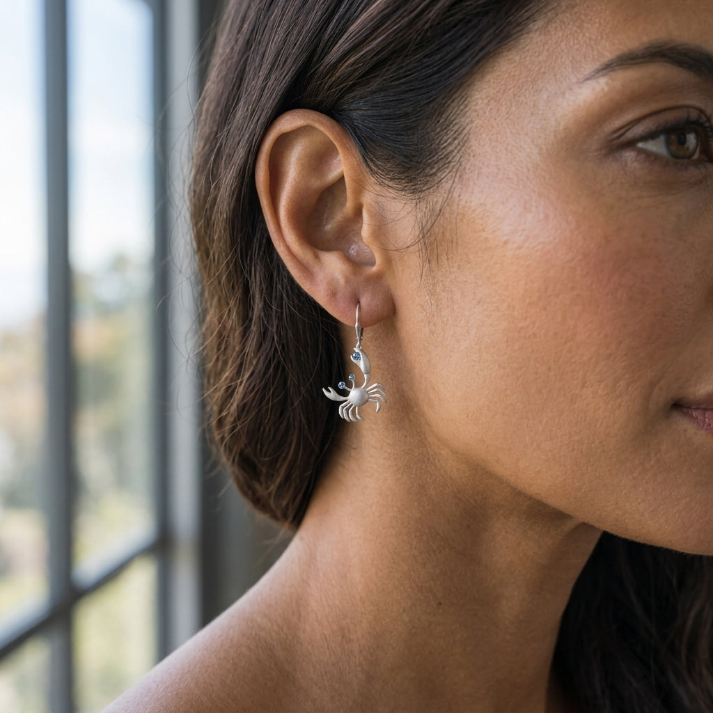 14k 17mm Crab Earrings with 6 Blue Diamonds — worn on model (brunette, view 2)