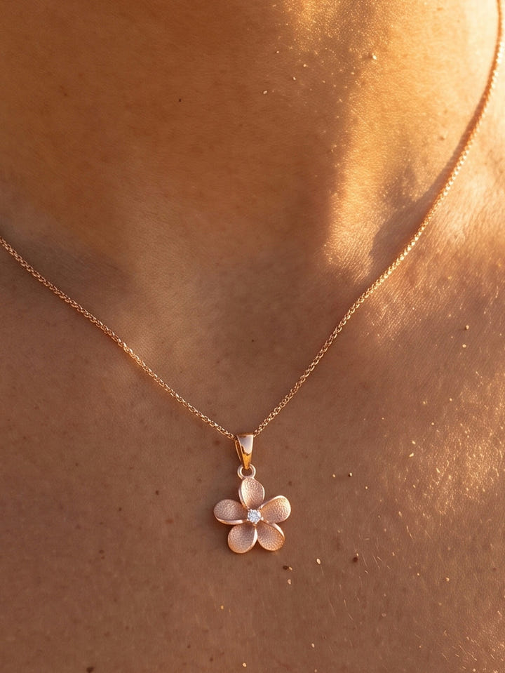 14k 11mm Plumeria Diamond Pendant — close-up on model