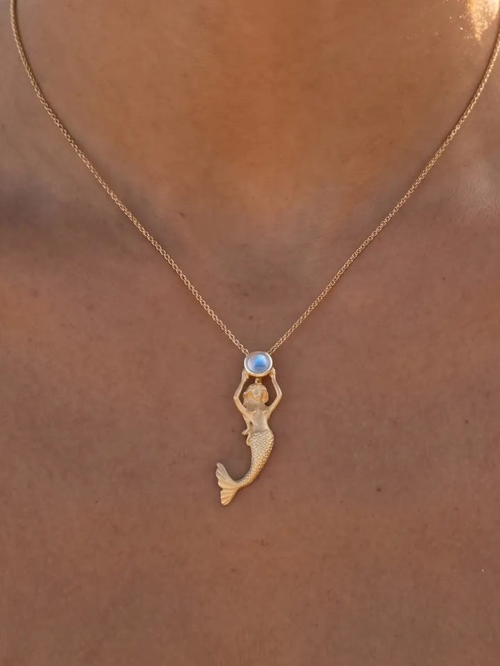 14ky Mermaid Pendant with Moonstone and Blue Topaz — close-up on model