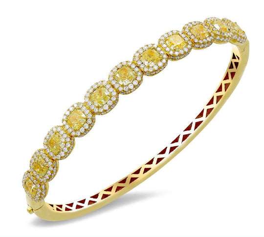 18K yellow gold bangle with 1.24 CT diamonds and 11 pc 4.61 CT yellow diamonds