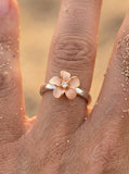 14k Plumeria Rose Gold and White Gold Diamond Ring — studio macro closeup on model (blonde)