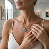 14K Medium Yellow Gold Wave Pendant with Diamond — worn on model (blonde, macro close-up)