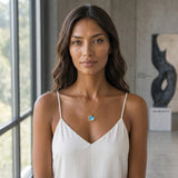 14K Small Yellow Gold Wave Pendant with Diamond — worn on model (brunette, view 2)