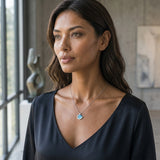 14K Small White Gold Wave Pendant with Diamond — worn on model (brunette, view 1)