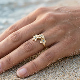 8mm 14k Plumeria Ring with 3 blue diamonds — worn on model (brunette, view 3)