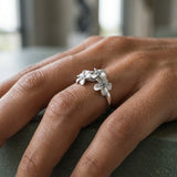 8mm 14k Plumeria Ring with 3 blue diamonds — worn on model (brunette, view 4)