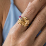 15mm 14k Hibiscus Ring with 2 diamonds and ruby — worn on model (blonde, view 4)