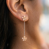 14k 7mm Plumeria Earrings with 6 Diamonds — worn on model (brunette, view 3)