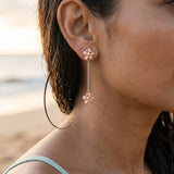 14k 7mm Plumeria Earrings with 6 Diamonds — worn on model (brunette, view 4)