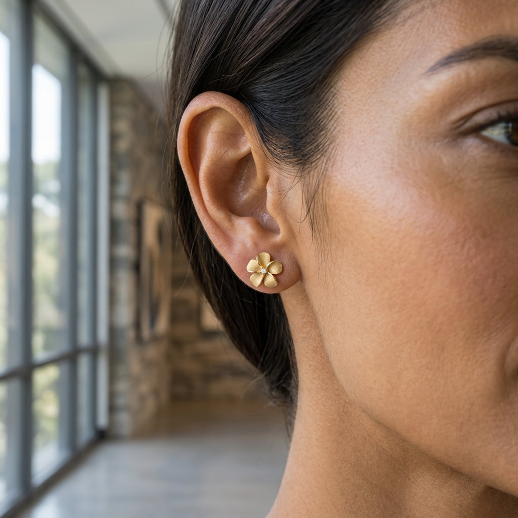 14k 11mm Plumeria Earrings with 2 Diamonds — worn on model (brunette, view 2)