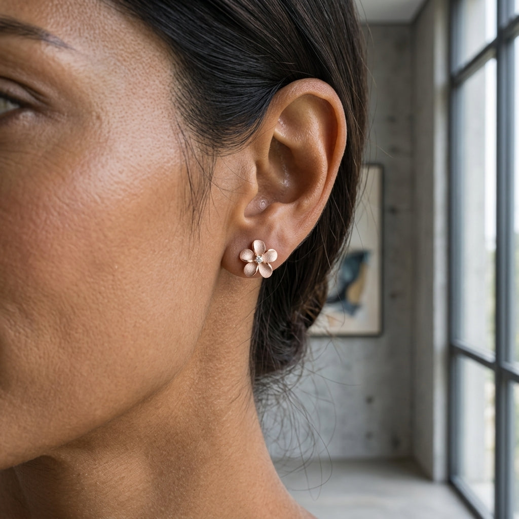 14k 8mm Plumeria Earrings with 2 Diamonds — worn on model (brunette, view 2)