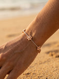 7mm 14k 2/tone Plumeria Bracelet with 14 diamonds — close-up on model