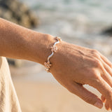 14k 2/tone Plumeria Lei Bracelet with 6 diamonds — worn on model (blonde, view 3)