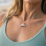 14k 2/tone 28mm "Jumping Loop" Dolphin Pendant with 16 diamonds — worn on model (blonde, view 3)