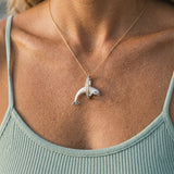 14k 2/tone 28mm "Jumping Loop" Dolphin Pendant with 16 diamonds — worn on model (blonde, view 4)