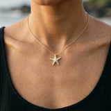 14k 16mm Starfish Pendant with 11 Diamonds — worn on model (brunette, view 3)