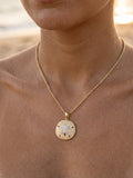 14k 25mm Sand Dollar Pendant with 12 Diamonds — close-up on model