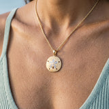 14k 25mm Sand Dollar Pendant with 12 Diamonds — worn on model (brunette, view 4)