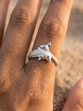 14k 10mm "Jumping Single" Dolphin Ring with blue diamond — close-up on model