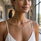 14k 2/tone 20mm "Open Sea" Dolphin Necklace with 4 diamonds — worn on model (brunette, view 1)