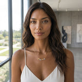14k 2/tone 20mm "Open Sea" Dolphin Necklace with 4 diamonds — worn on model (brunette, view 2)