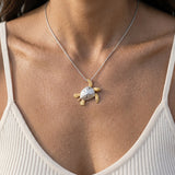 14k 2/tone 25mm Sea Turtle Pendant with 2 Diamonds — worn on model (brunette, view 3)