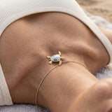 14k 2/tone 25mm Sea Turtle Pendant with 2 Diamonds — worn on model (brunette, view 4)